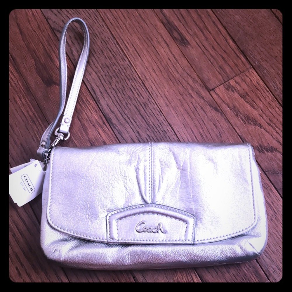 Silver coach clutch purse